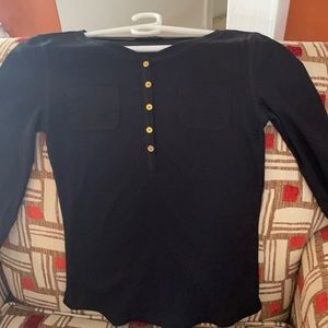 A black long sleeve sweater.